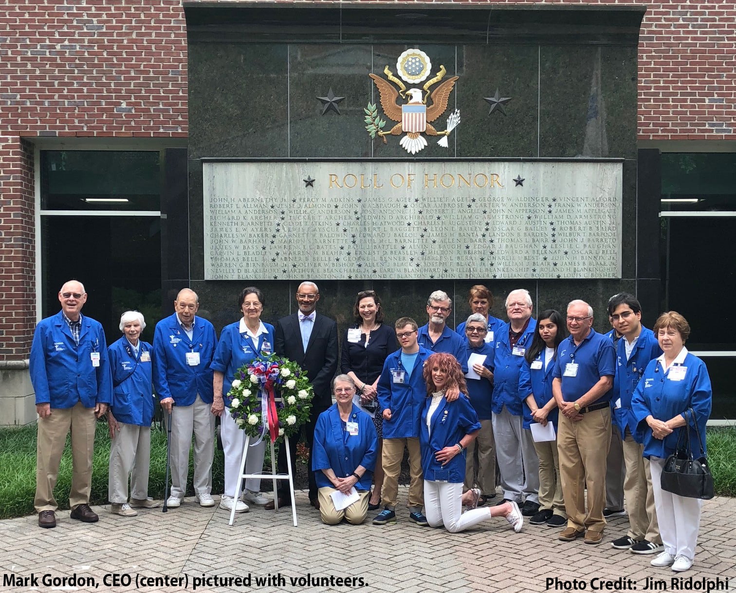 Memorial Regional Medical Center staff gathered in front of the "Roll of Honor" memorial statue